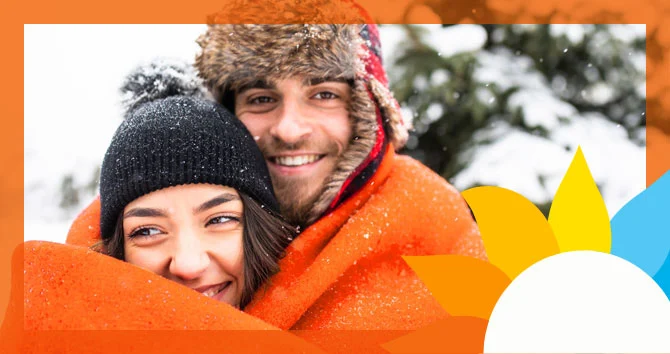 two people embracing in the snow